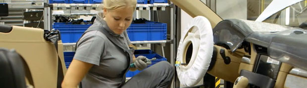 Porsche 911 Production Line Airbag Installation Girl Featured